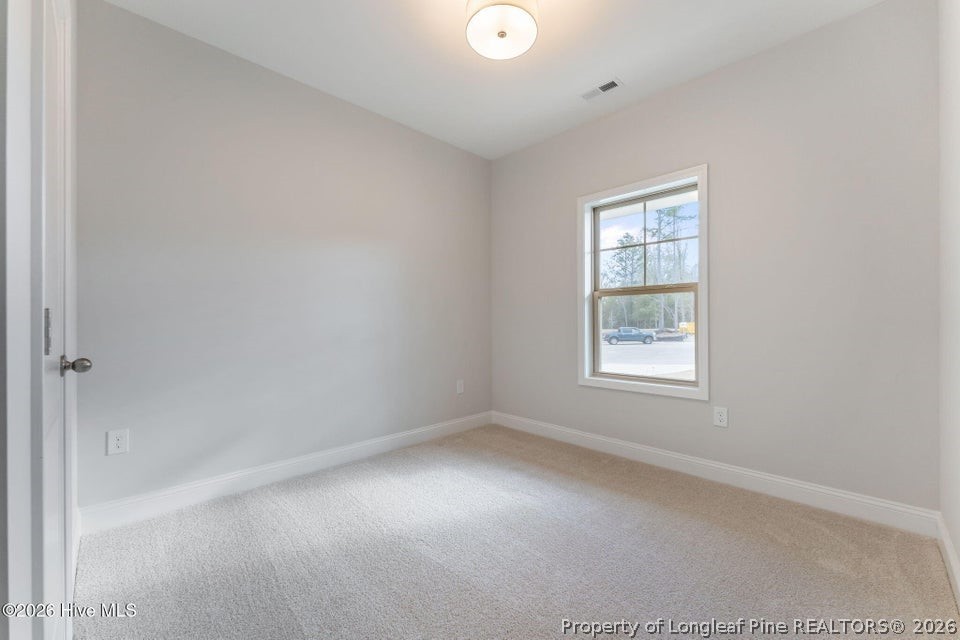 229 Telluride Court Aberdeen, NC 28315 - Photo 15 of 19 an empty room with windows
