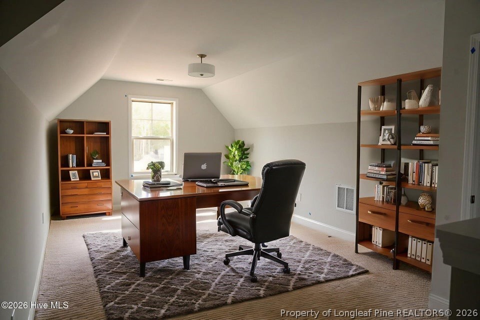 229 Telluride Court Aberdeen, NC 28315 - Photo 18 of 19 a view of a workspace with furniture and a window