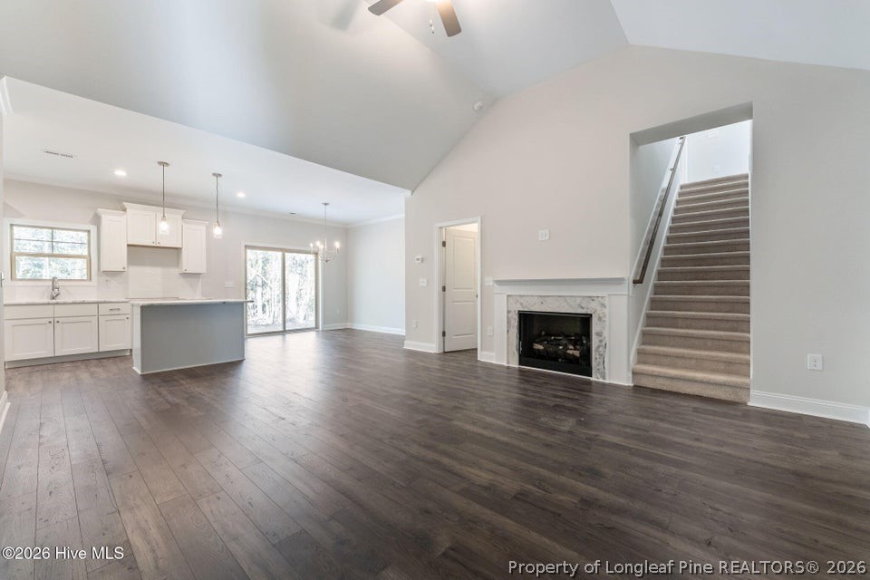229 Telluride Court Aberdeen, NC 28315 - Photo 2 of 19 a view of kitchen and hall with wooden floor