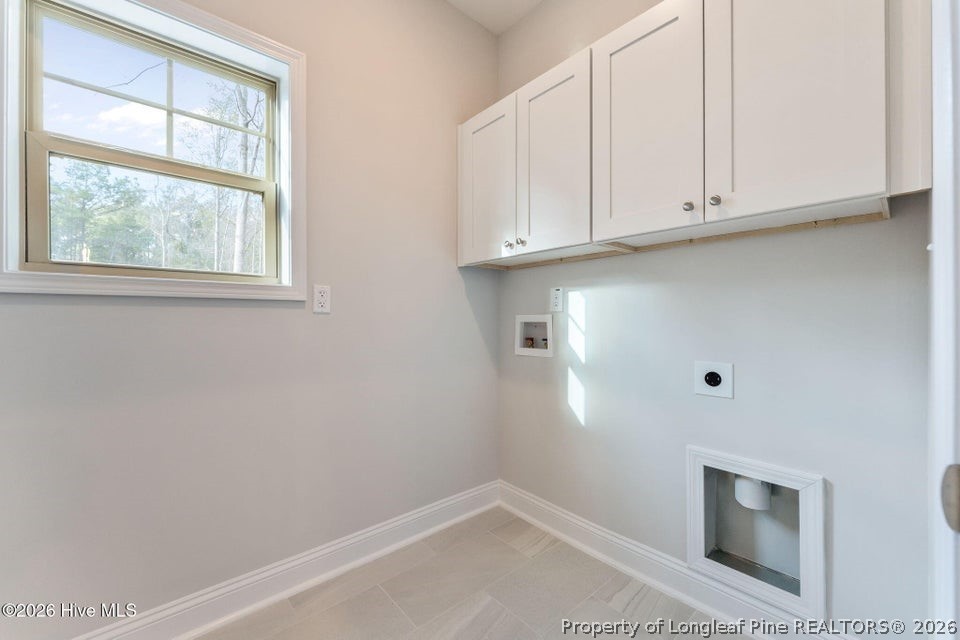 229 Telluride Court Aberdeen, NC 28315 - Photo 5 of 19 a view of storage and utility room with a fireplace
