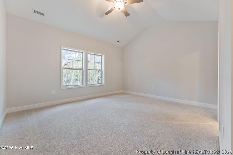 229 Telluride Court Aberdeen, NC 28315 - Photo 8 of 19 an empty room with a window and a fan
