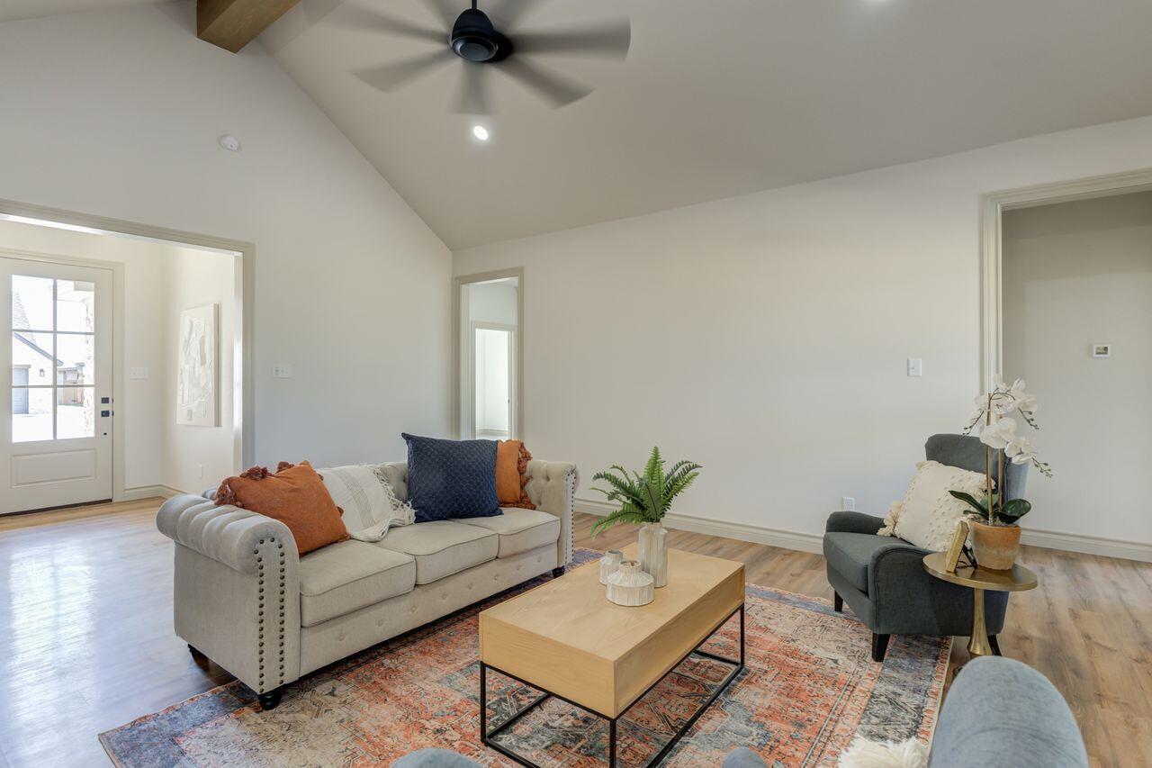 5524 120th Street Lubbock, TX 79424 - Photo 11 of 39 a living room with furniture and a potted plant