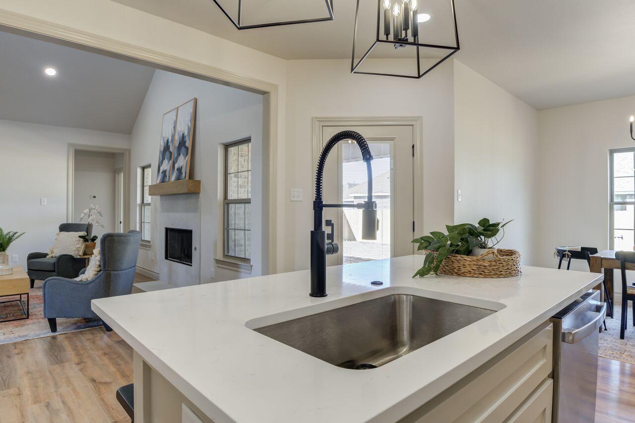 5524 120th Street Lubbock, TX 79424 - Photo 20 of 39 a kitchen with a refrigerator and a sink