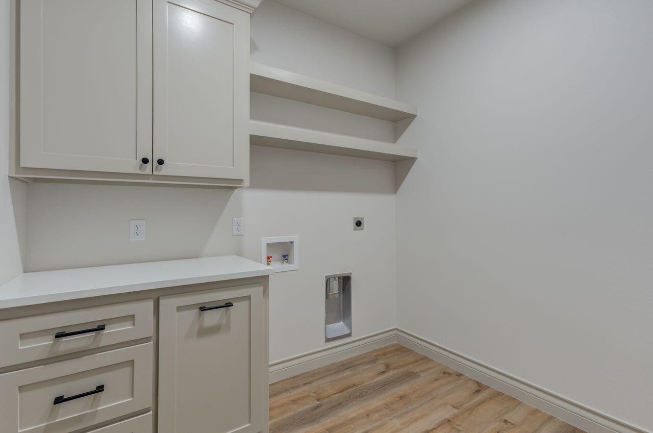 5524 120th Street Lubbock, TX 79424 - Photo 24 of 39 a view of cabinets and wooden floor
