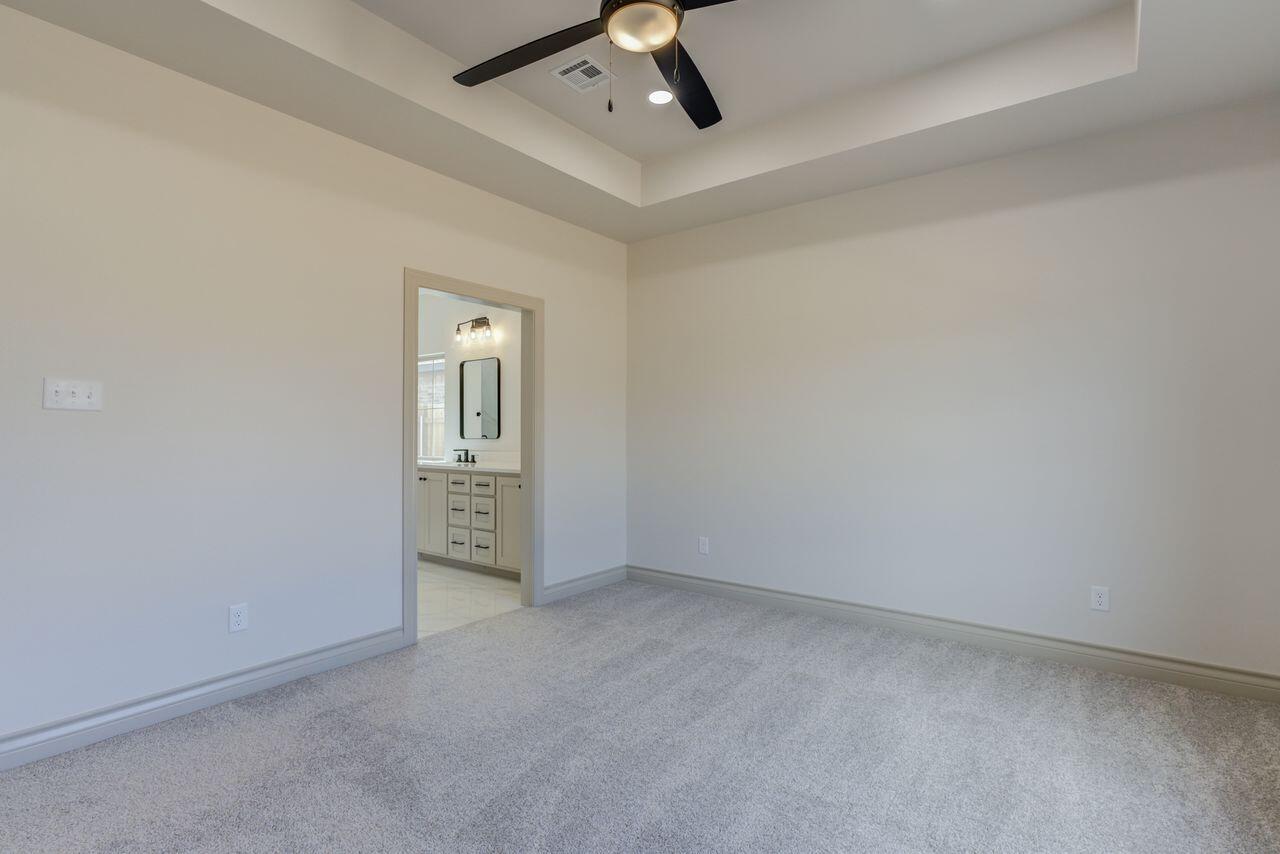 5524 120th Street Lubbock, TX 79424 - Photo 31 of 39 an empty room with chandelier fan