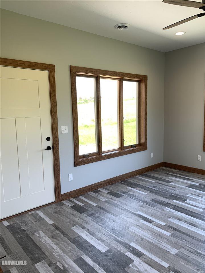 407 Oak Ridge Drive Lena, IL 61048 - Photo 23 of 50 a view of an empty room with window and closet area