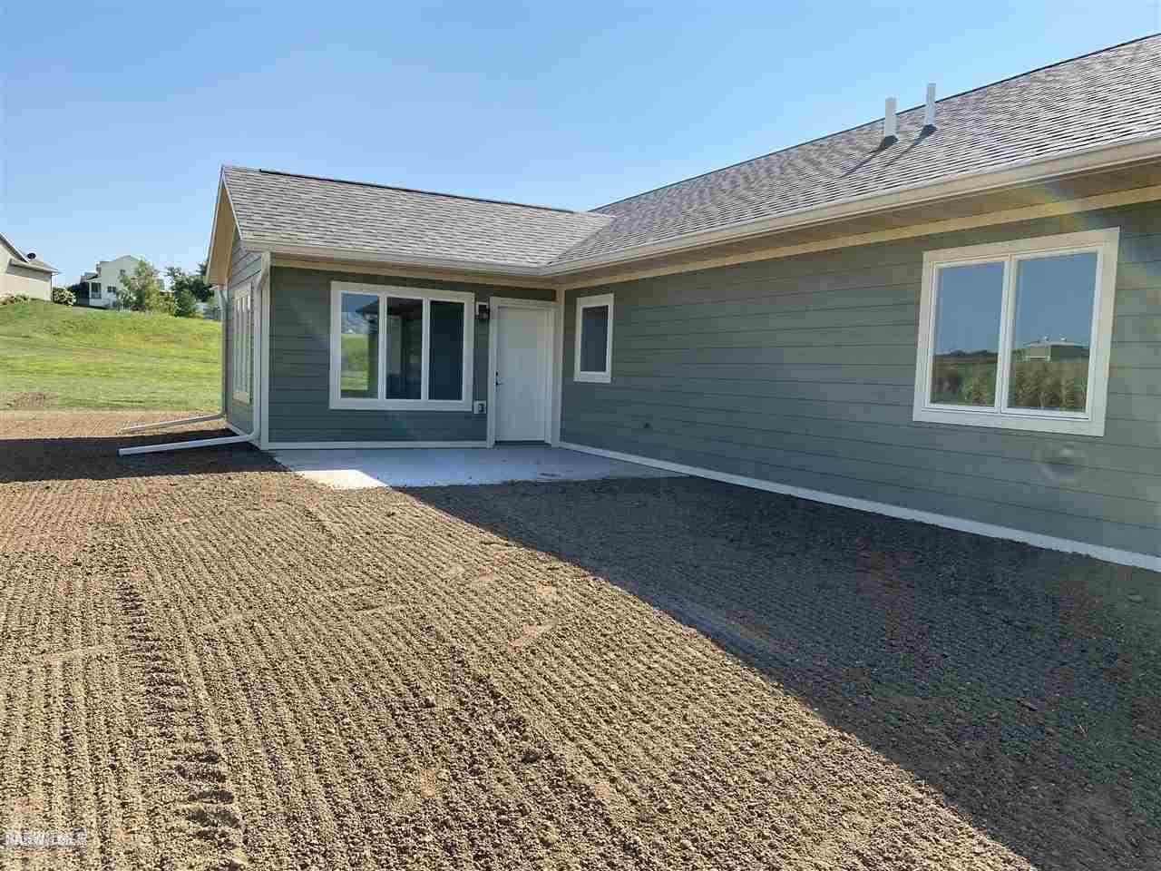 407 Oak Ridge Drive Lena, IL 61048 - Photo 24 of 50 a front view of a house with a yard