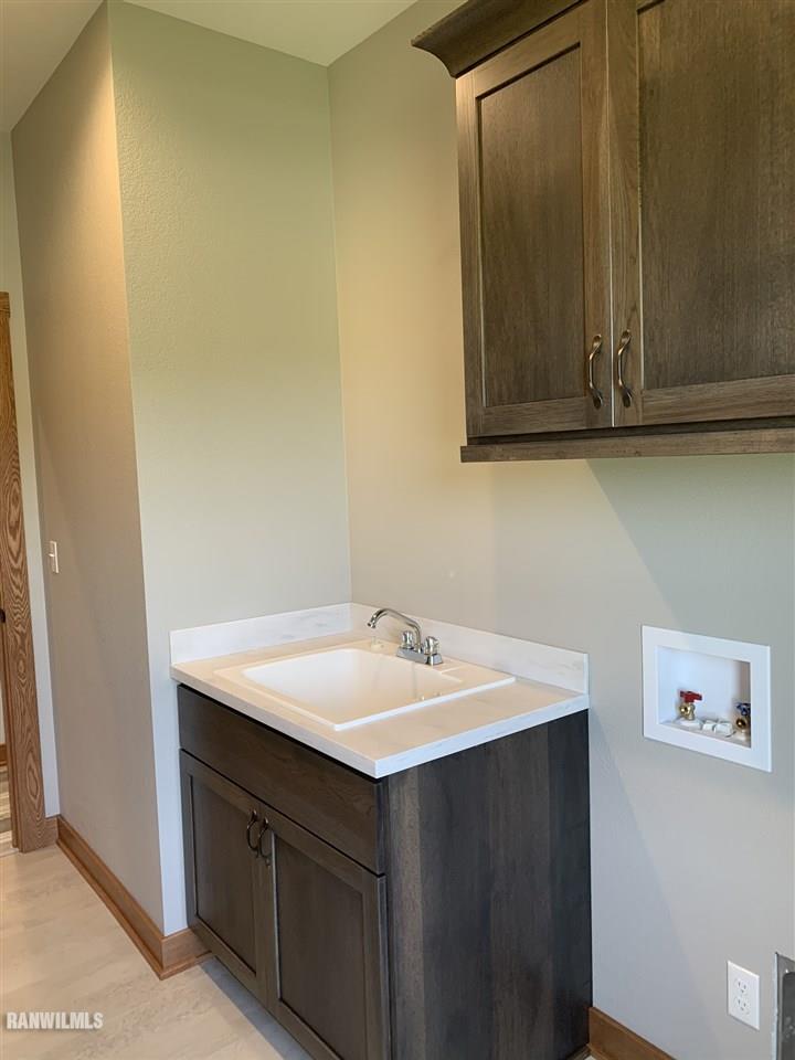 407 Oak Ridge Drive Lena, IL 61048 - Photo 27 of 50 a bathroom with a sink and a mirror
