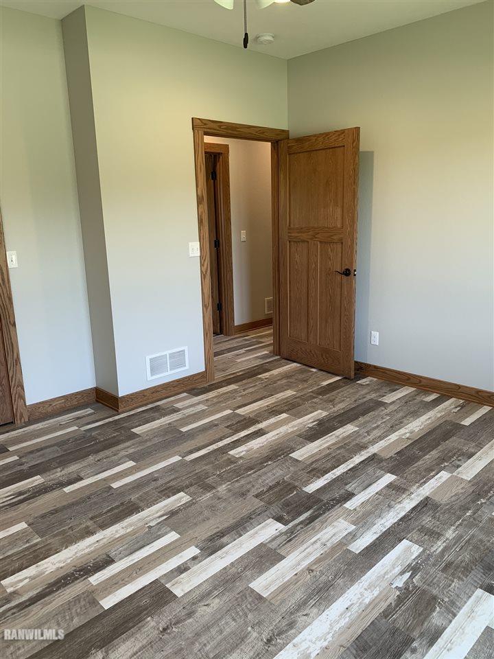 407 Oak Ridge Drive Lena, IL 61048 - Photo 34 of 50 a view of a livingroom with wooden floor