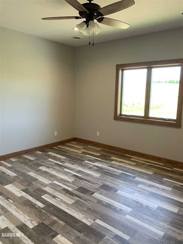 407 Oak Ridge Drive Lena, IL 61048 - Photo 37 of 50 a view of a room that has a window and a ceiling fan