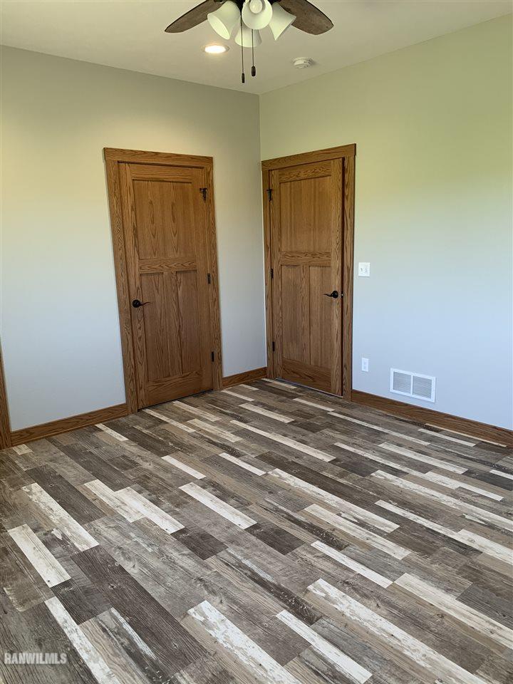 407 Oak Ridge Drive Lena, IL 61048 - Photo 39 of 50 a view of a bedroom and a bathroom