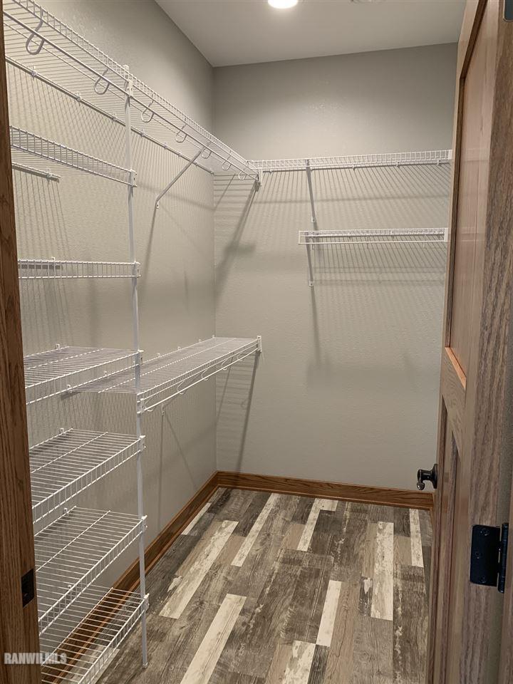407 Oak Ridge Drive Lena, IL 61048 - Photo 41 of 50 a view of a room with racks on the wall