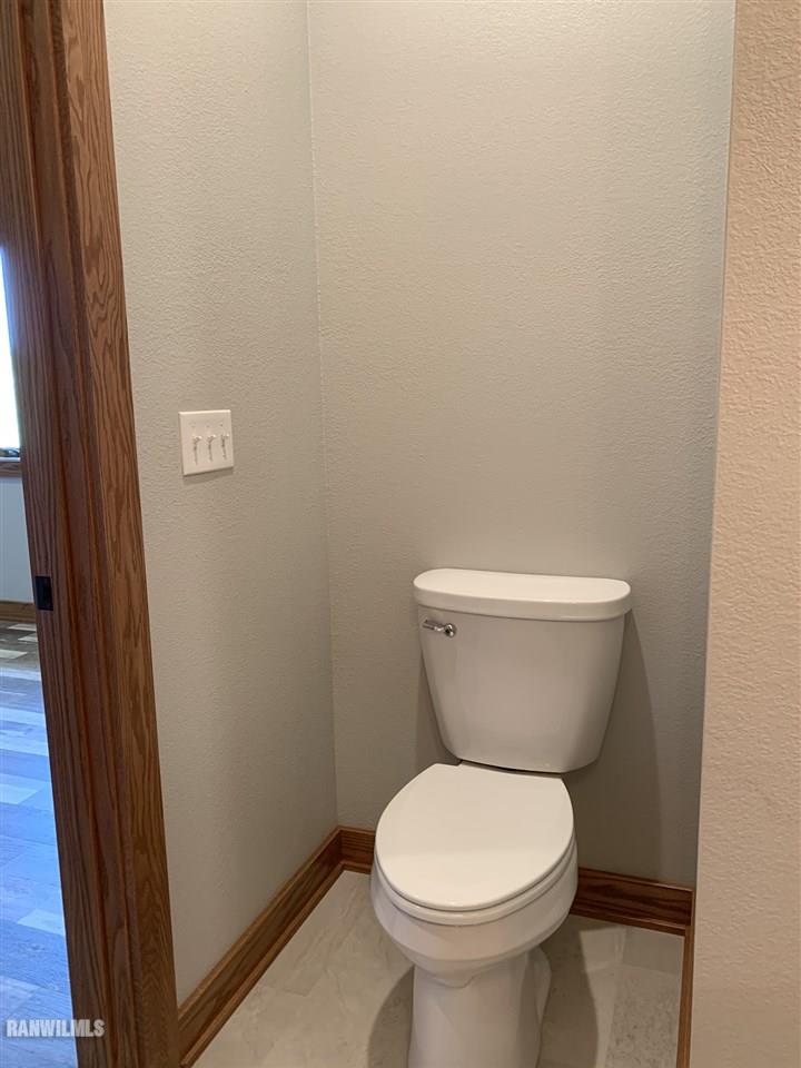 407 Oak Ridge Drive Lena, IL 61048 - Photo 47 of 50 a white toilet sitting next to a sink