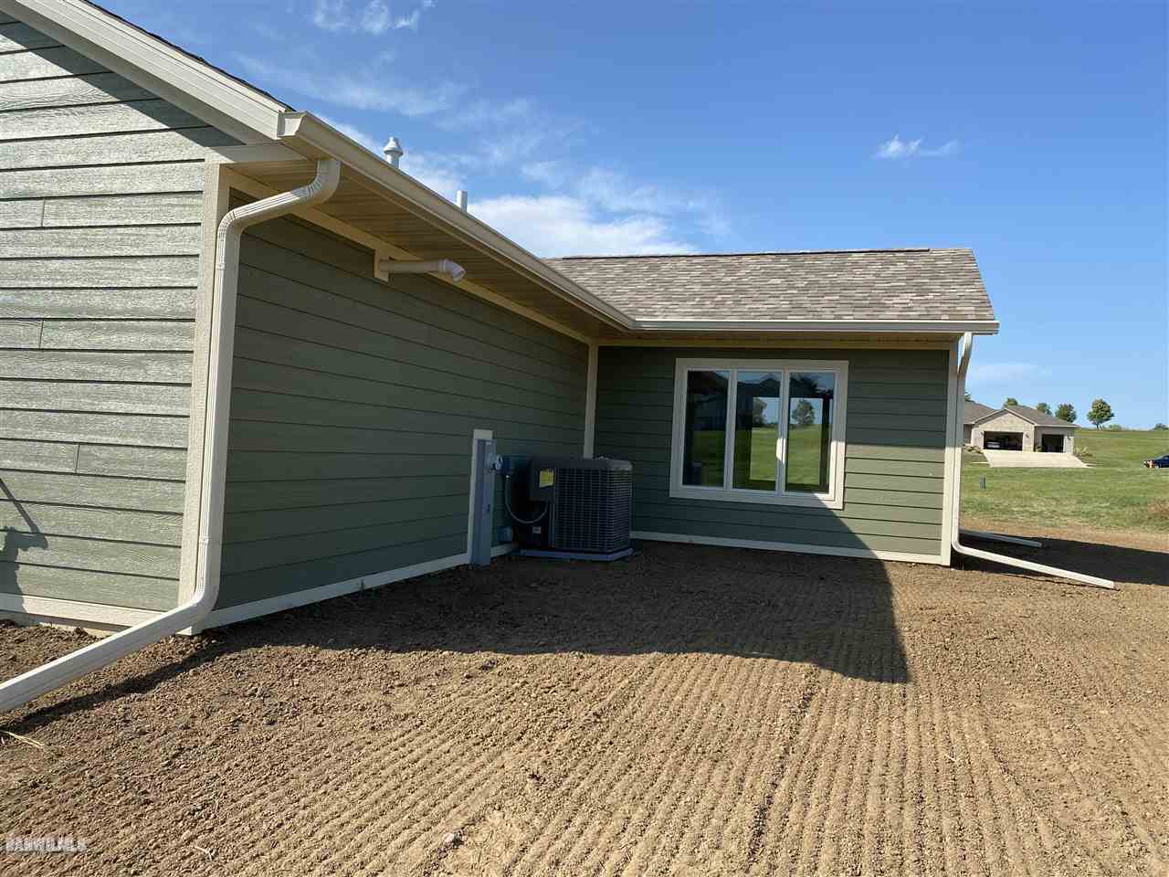 407 Oak Ridge Drive Lena, IL 61048 - Photo 5 of 50 a front view of a house with a yard
