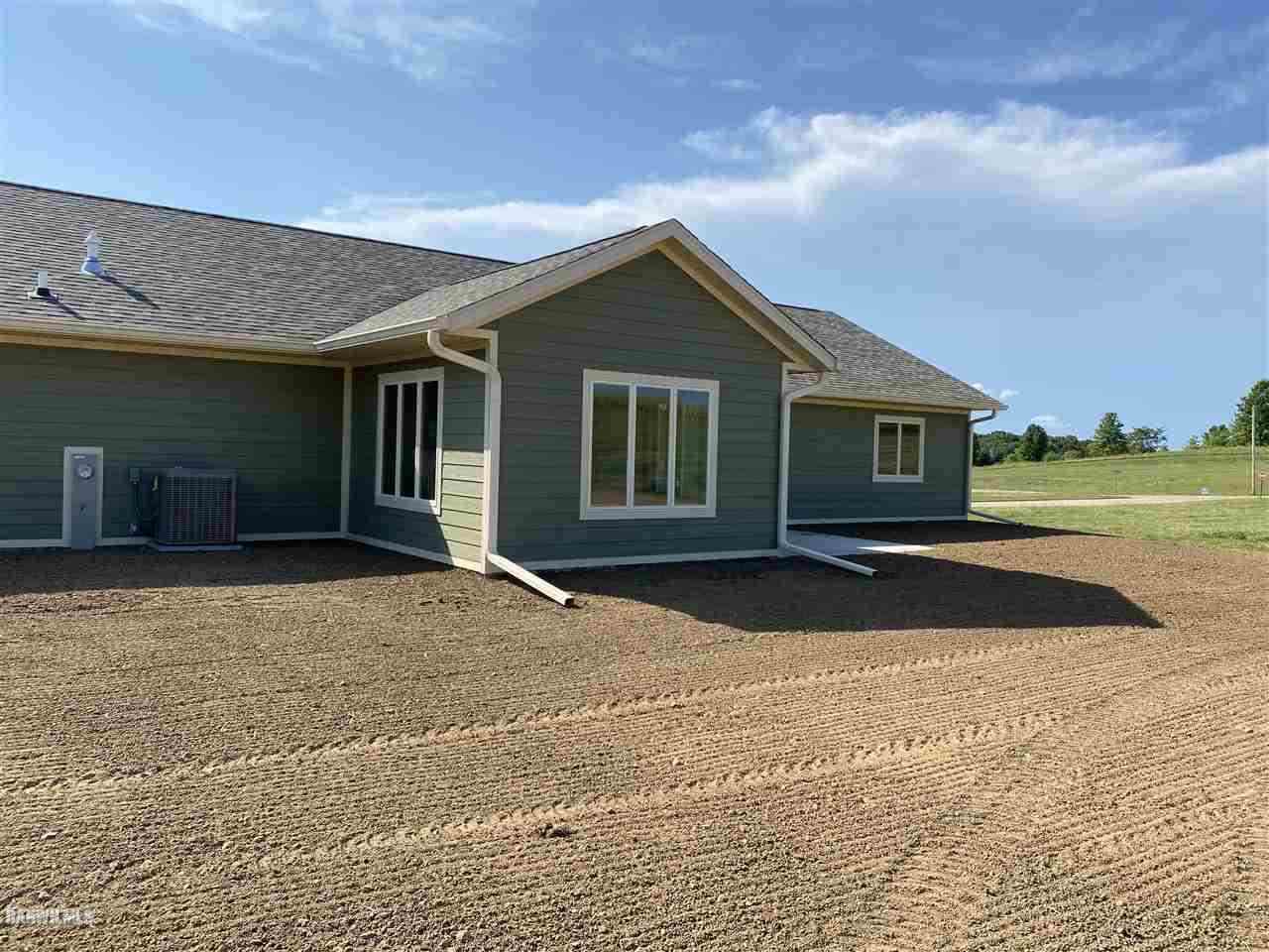 407 Oak Ridge Drive Lena, IL 61048 - Photo 6 of 50 a front view of a house with a yard and garage