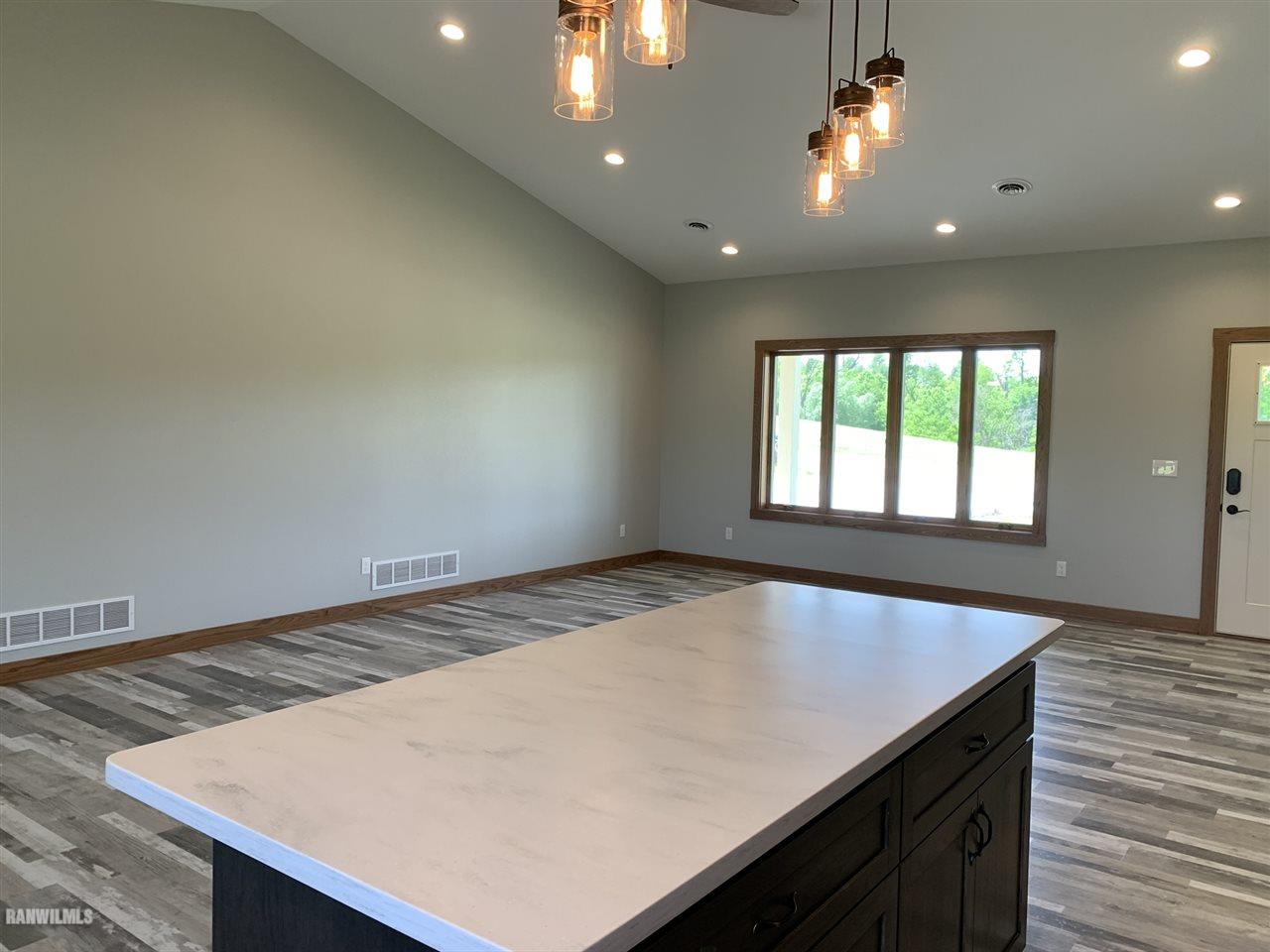 407 Oak Ridge Drive Lena, IL 61048 - Photo 10 of 50 an empty room with wooden floor