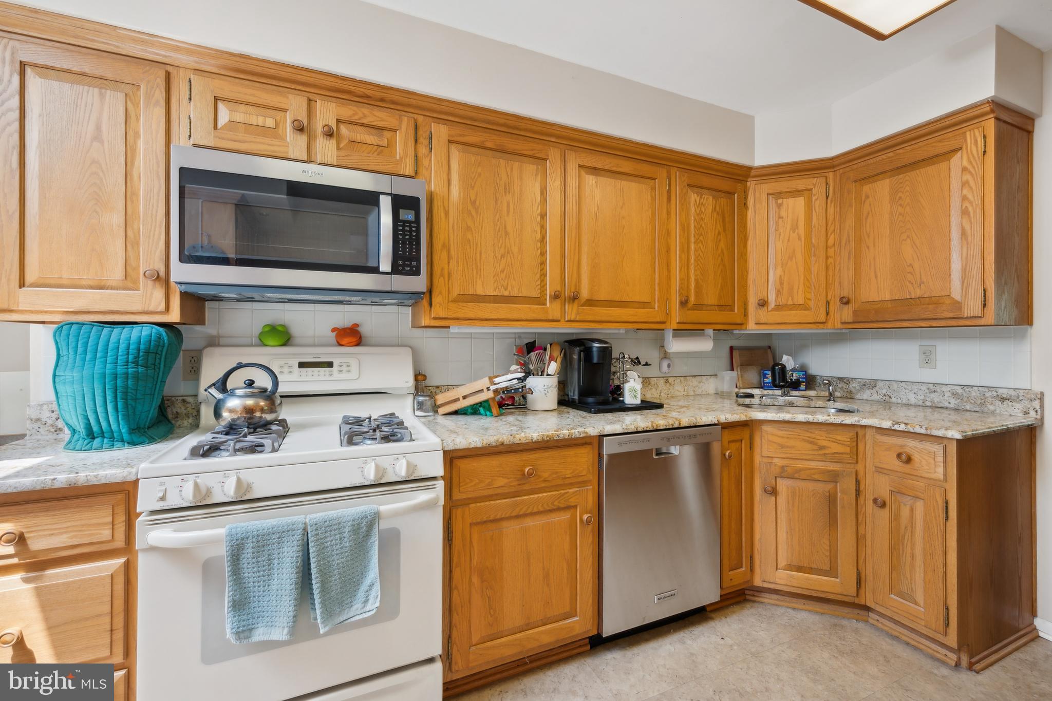 2 Tomahawk Drive Marlton, NJ 08053 - Photo 12 of 26 a kitchen with a sink stove and microwave