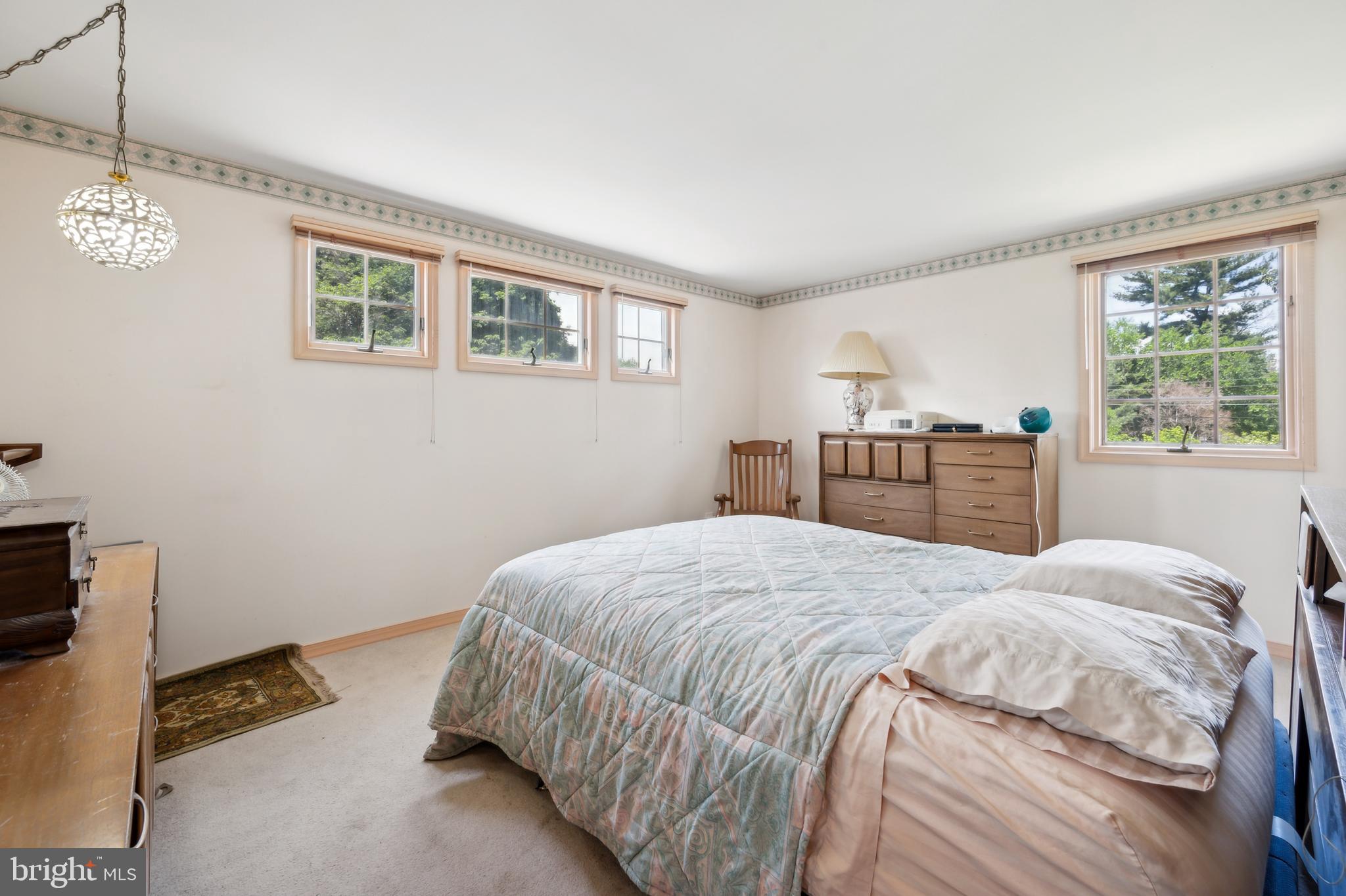2 Tomahawk Drive Marlton, NJ 08053 - Photo 18 of 26 a bedroom with a bed wooden floor and window