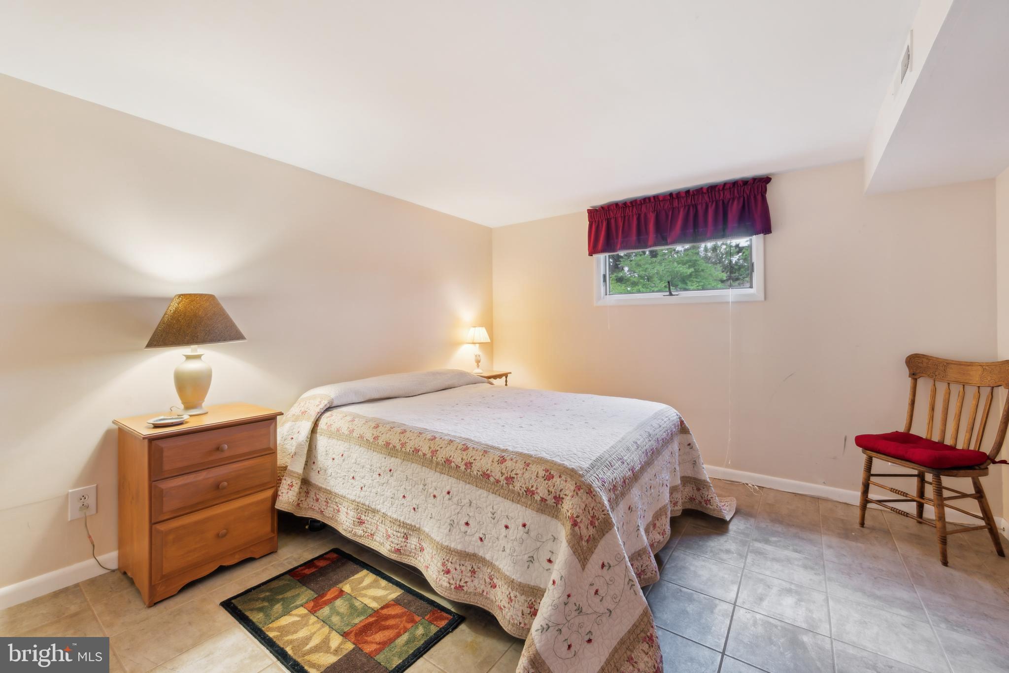 2 Tomahawk Drive Marlton, NJ 08053 - Photo 22 of 26 a bedroom with a bed and a lamp