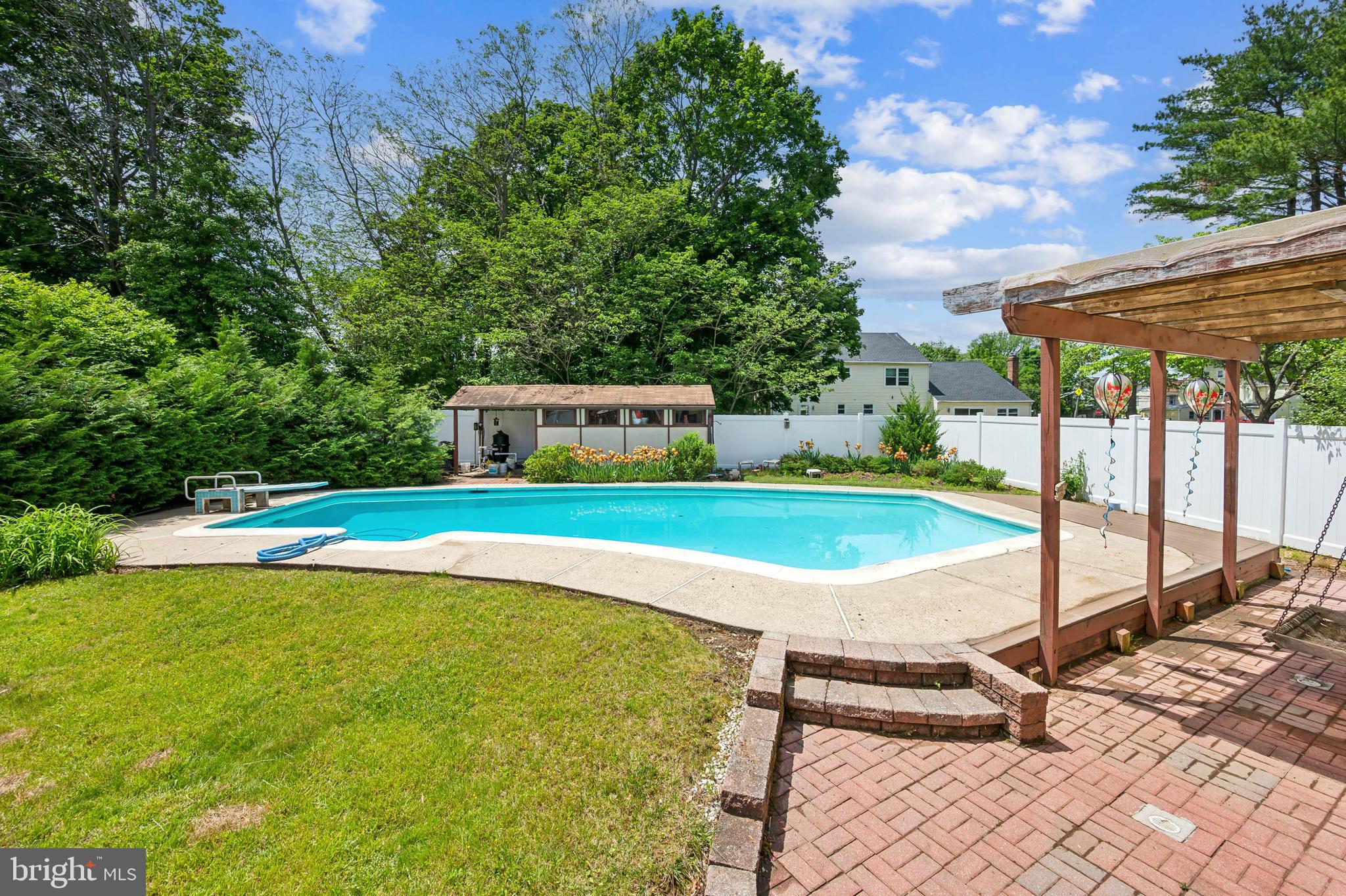 2 Tomahawk Drive Marlton, NJ 08053 - Photo 24 of 26 a view of a swimming pool with a yard