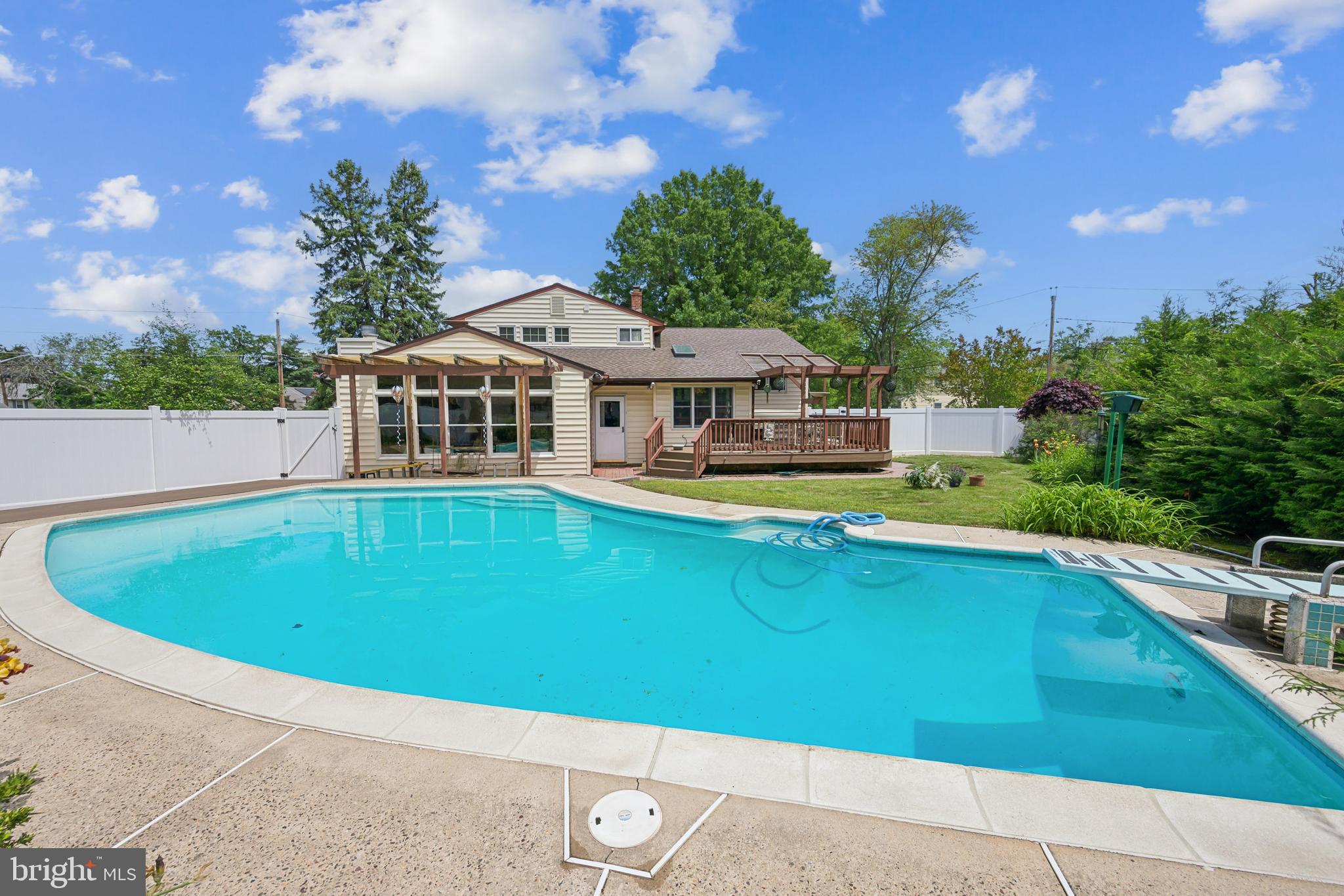 2 Tomahawk Drive Marlton, NJ 08053 - Photo 25 of 26 a view of a house with pool and trees in the background