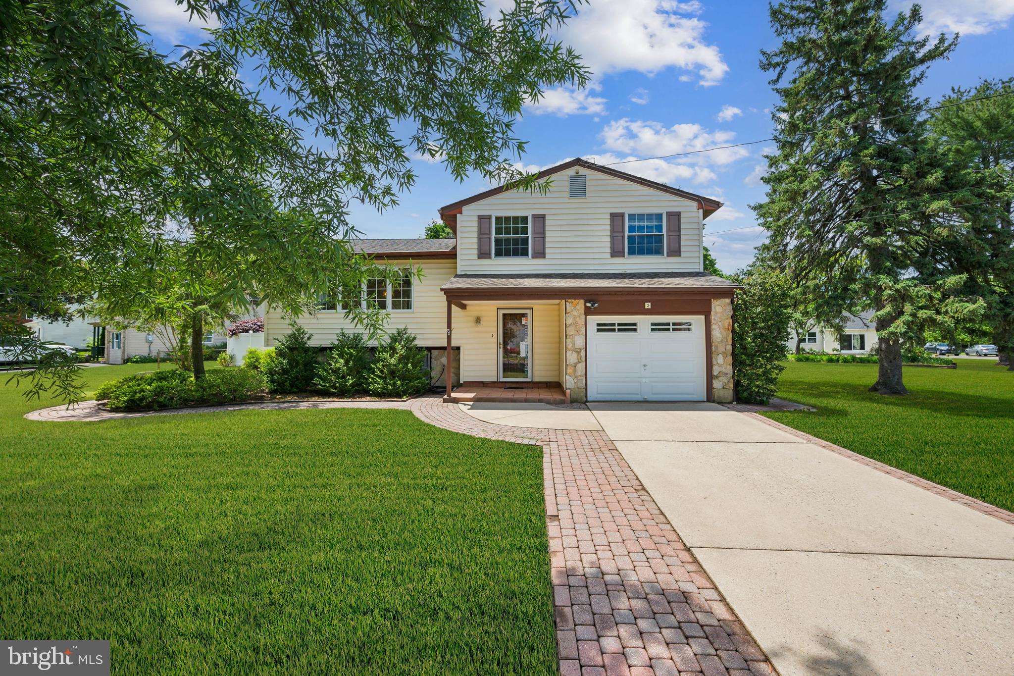 2 Tomahawk Drive Marlton, NJ 08053 - Photo 26 of 26 a front view of a house with a yard and trees