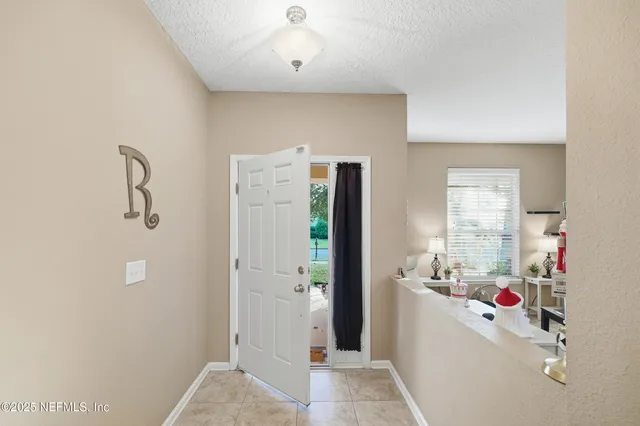a view of a dining room with furniture and window