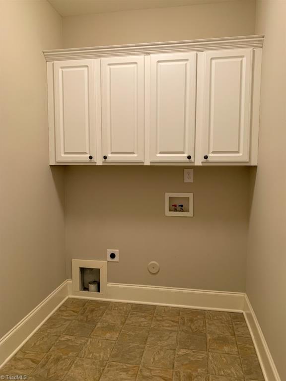 516 Barnsdale Ridge Road Kernersville, NC 27284 - Photo 11 of 36 First Floor walk in Laundry with Cabinetry.