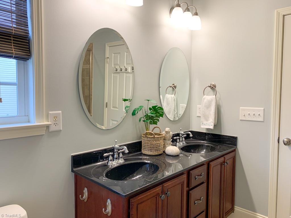 516 Barnsdale Ridge Road Kernersville, NC 27284 - Photo 16 of 36 Primary Bathroom with Double Sinks, Separate tiled shower and Soaking Tub. Adjacent Walk-in Closet.