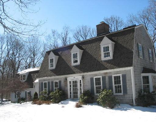 18 Strawberry Ridge Road Ridgefield, CT 06877 - Photo 1 of 1 a front view of a house with a yard