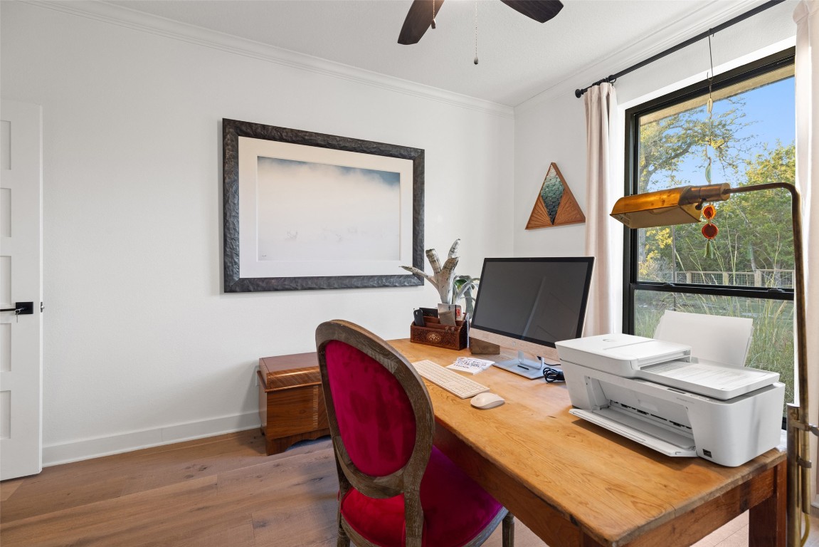 120 Oak Springs Drive Dripping Springs, TX 78620 - Photo 13 of 35 a view of a dining room with furniture window and wooden floor