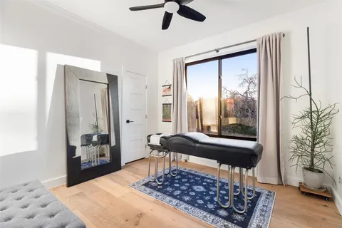 a living room with furniture fireplace and a flat screen tv