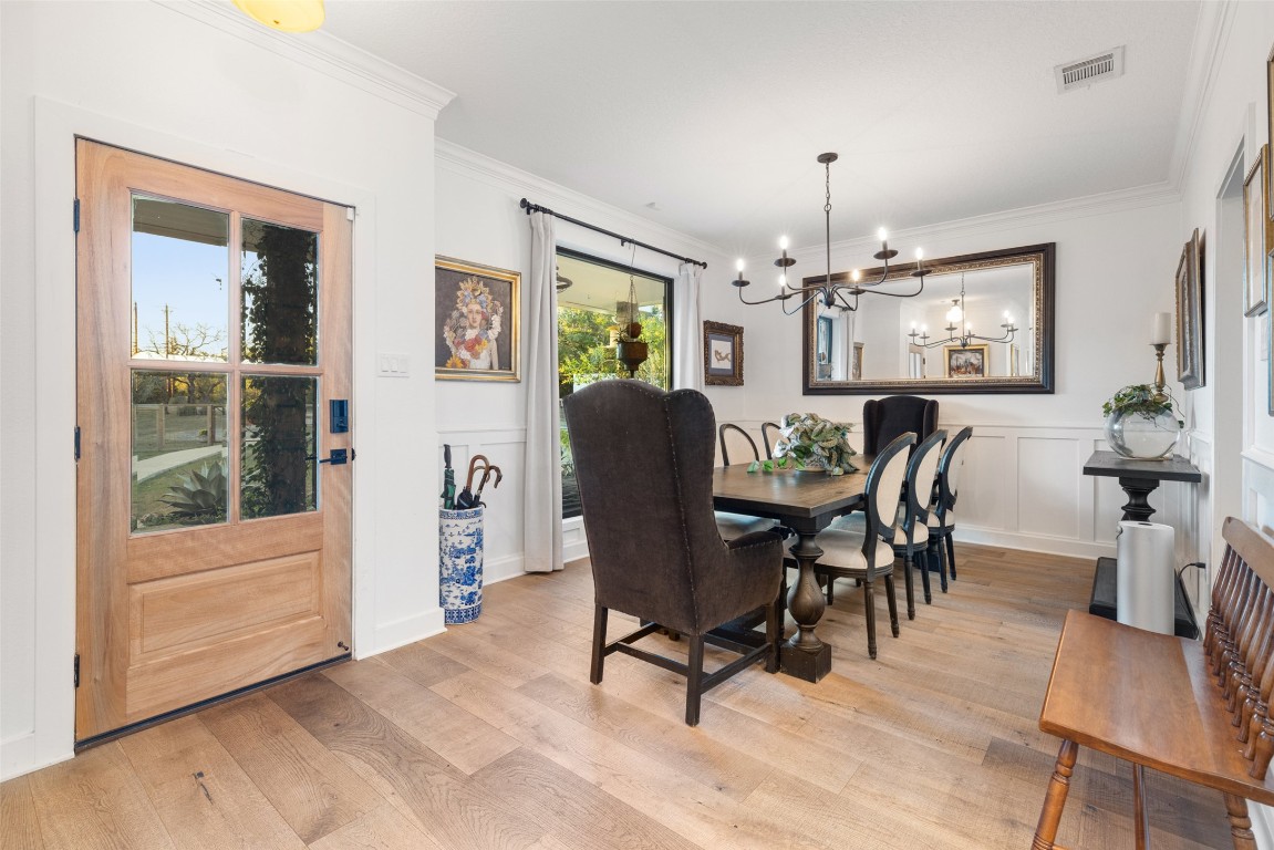 120 Oak Springs Drive Dripping Springs, TX 78620 - Photo 17 of 35 a view of a dining room with furniture window and wooden floor