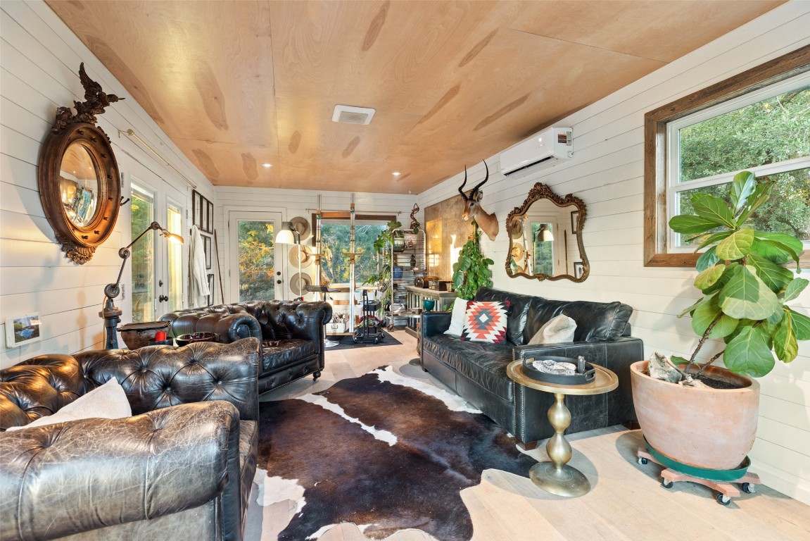 120 Oak Springs Drive Dripping Springs, TX 78620 - Photo 28 of 35 a living room with furniture and a large window