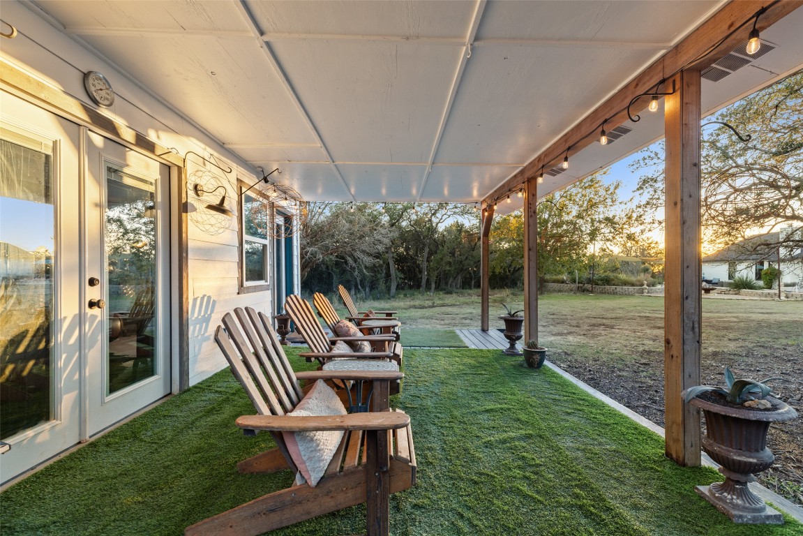 120 Oak Springs Drive Dripping Springs, TX 78620 - Photo 30 of 35 View of grassy yard featuring a patio area