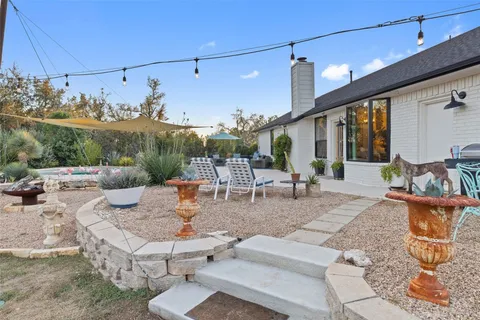 a view of a livingroom with wooden floor and a bedroom