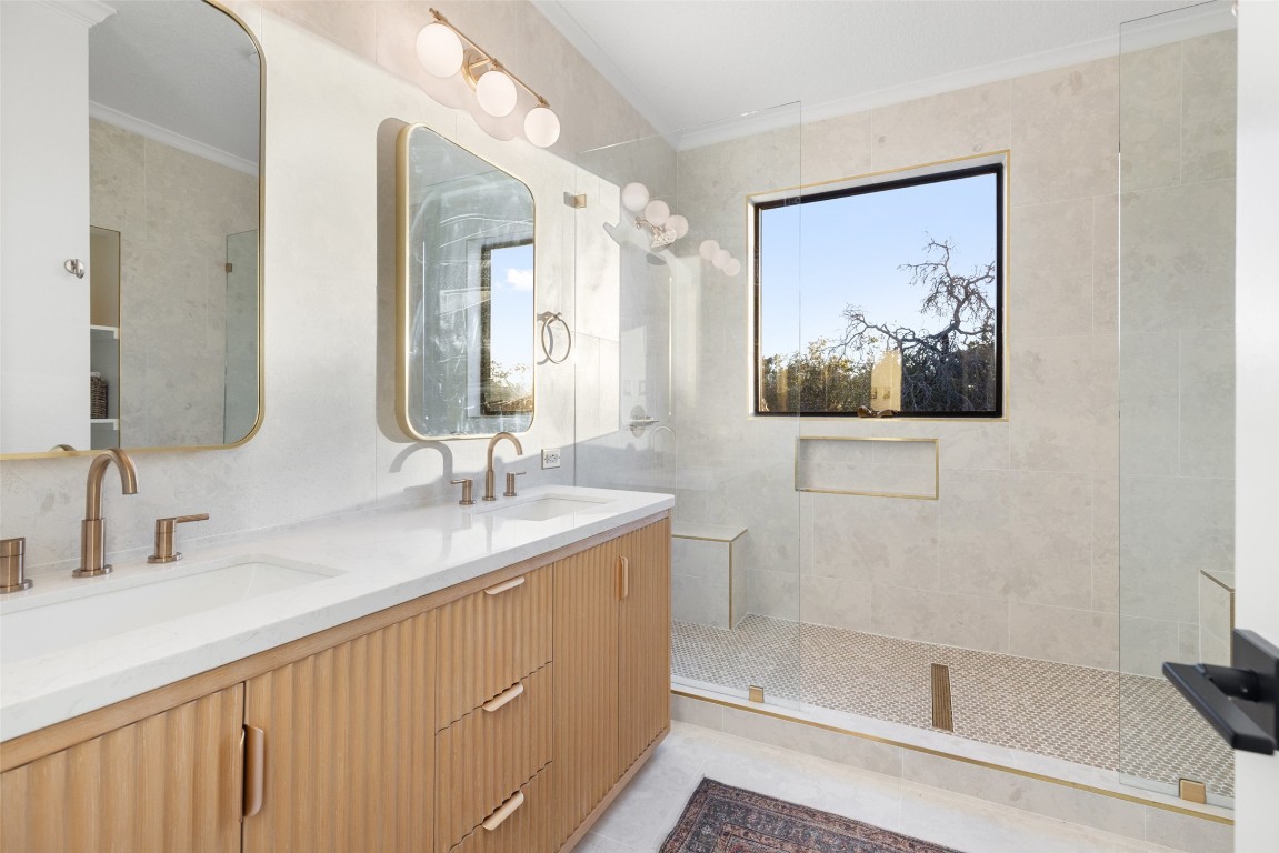 120 Oak Springs Drive Dripping Springs, TX 78620 - Photo 10 of 35 Bathroom featuring ornamental molding, double vanity, and a walk in shower