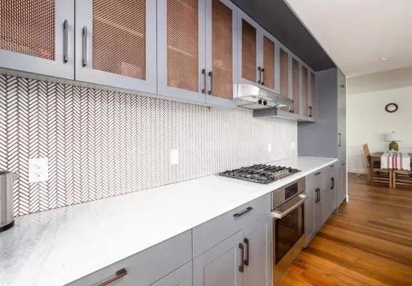 a kitchen with stainless steel appliances granite countertop a stove and a sink