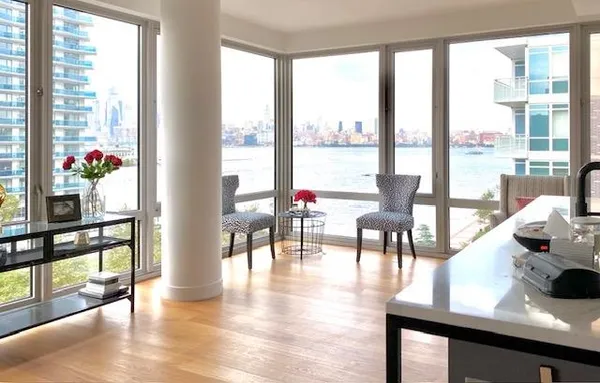 a living room with furniture and a large window