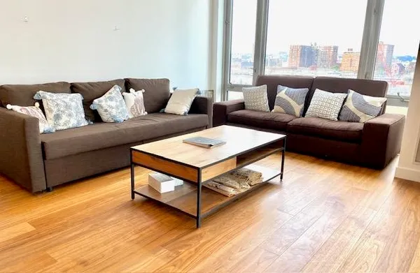 a living room with furniture and a large window