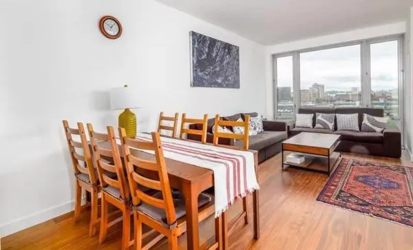 a bedroom with furniture and a window