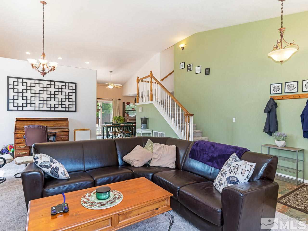 9799 Northrup Drive Reno, NV 89521 - Photo 5 of 16 a living room with furniture and a chandelier