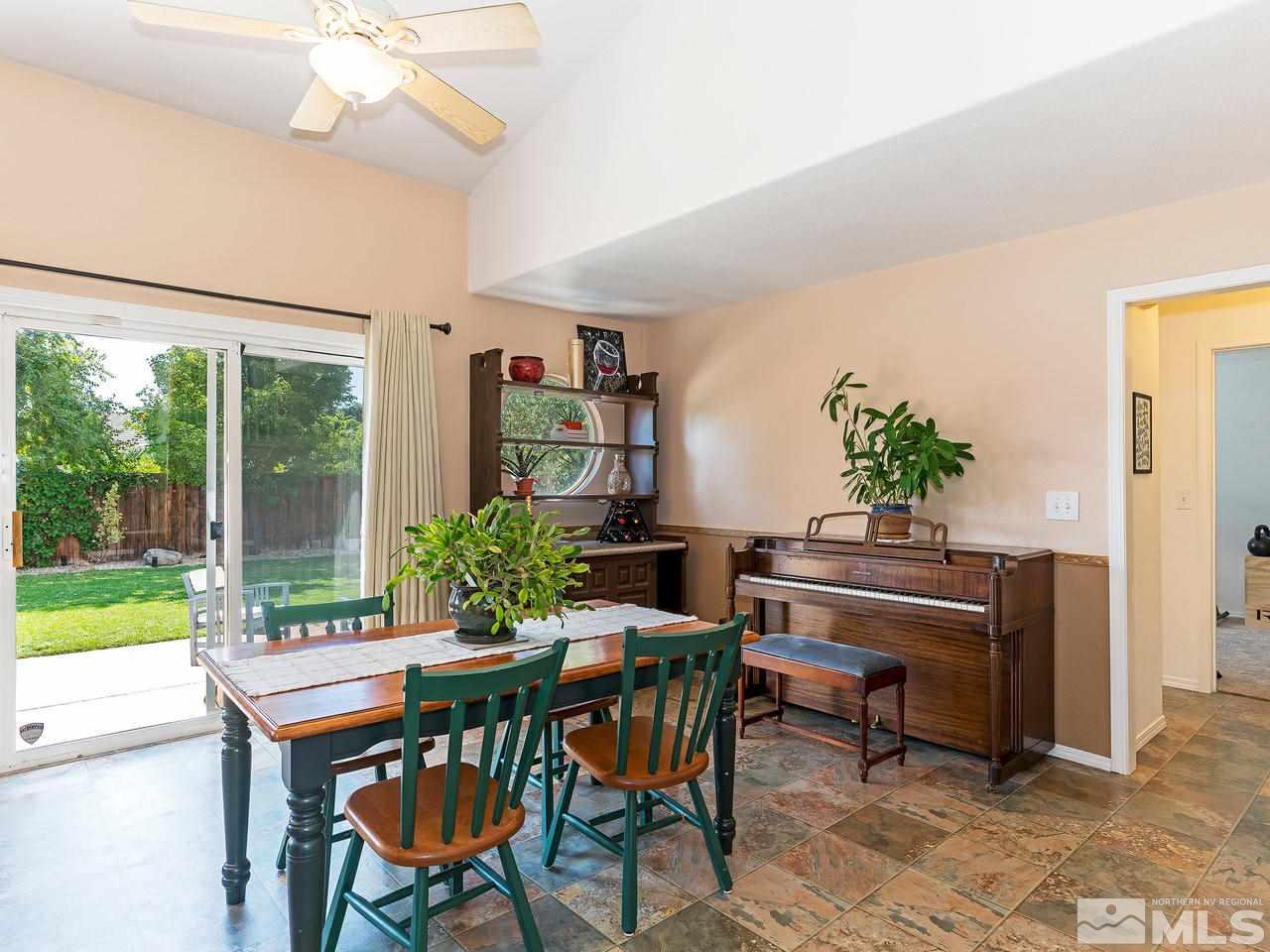 9799 Northrup Drive Reno, NV 89521 - Photo 8 of 16 a view of a dining room with furniture window and outside view