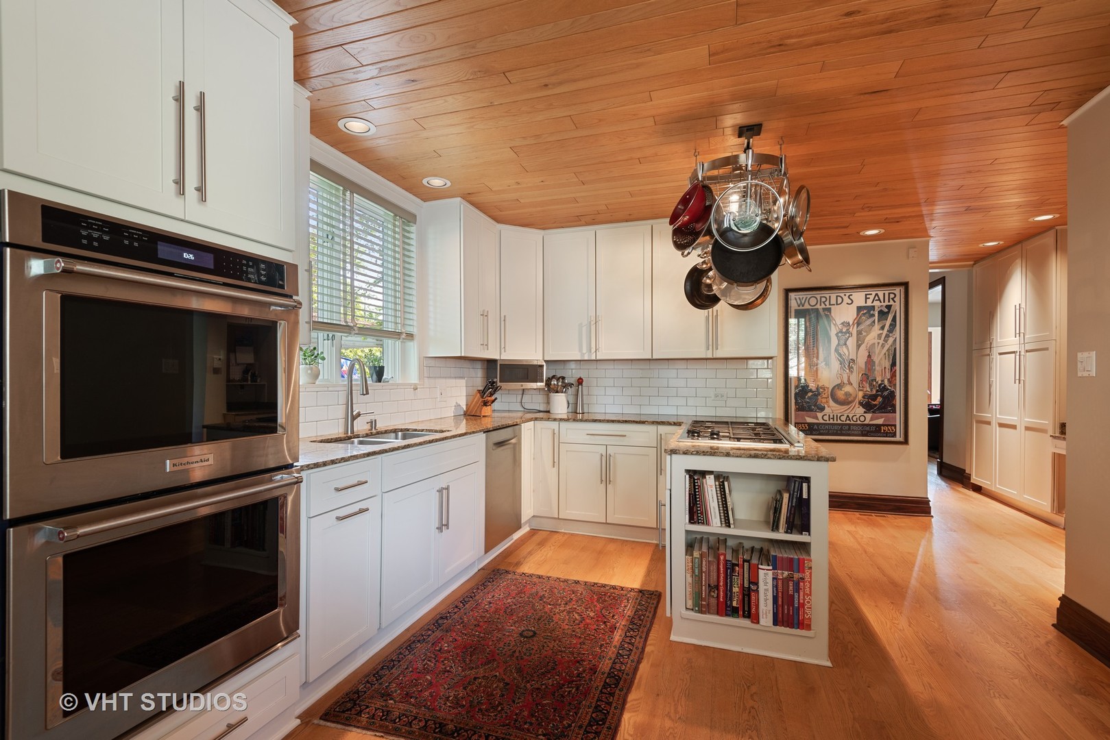 7406 North Sheridan Road Chicago, IL 60626 - Photo 11 of 37 a kitchen with a sink stainless steel appliances and cabinets