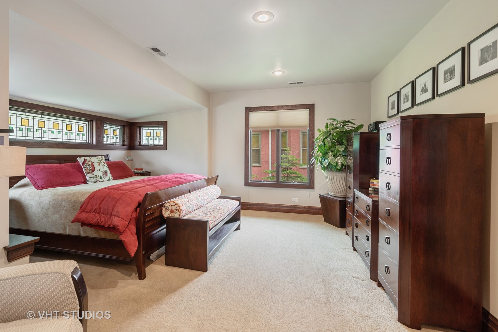 7406 North Sheridan Road Chicago, IL 60626 - Photo 14 of 37 a bedroom with a bed dresser and a refrigerator