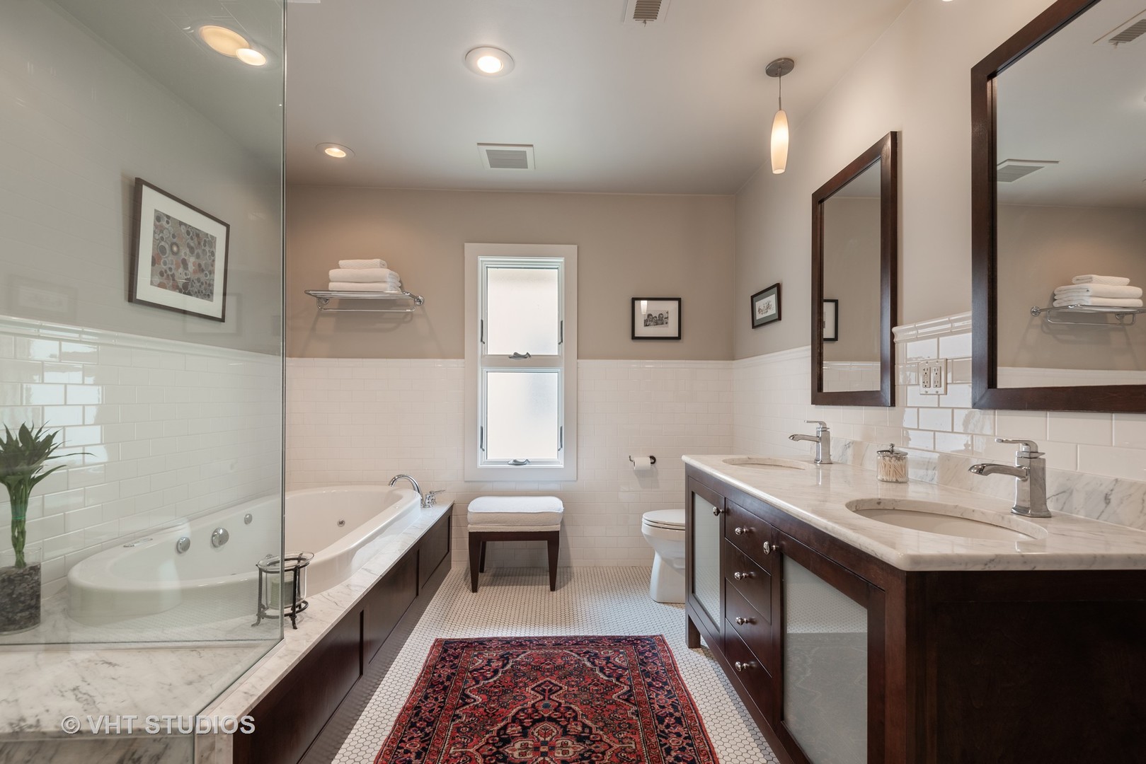 7406 North Sheridan Road Chicago, IL 60626 - Photo 16 of 37 a spacious bathroom with a double vanity sink and a mirror