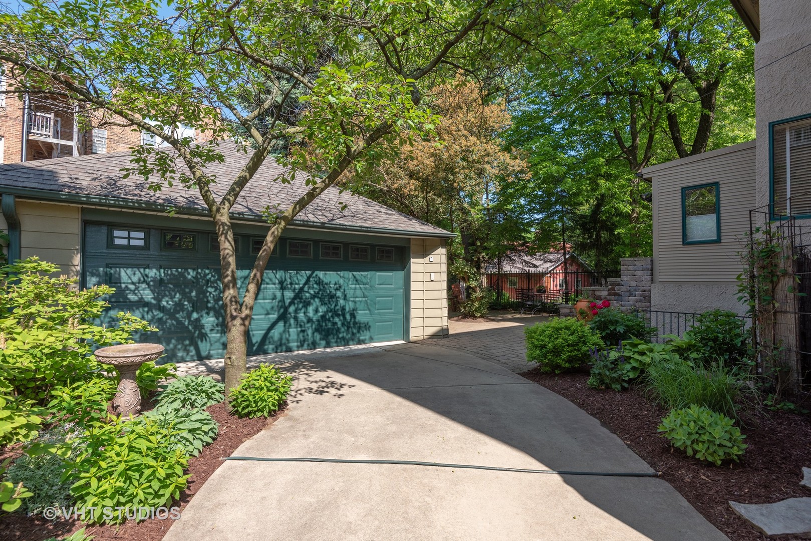 7406 North Sheridan Road Chicago, IL 60626 - Photo 31 of 37 a front view of a house with a yard and potted plants