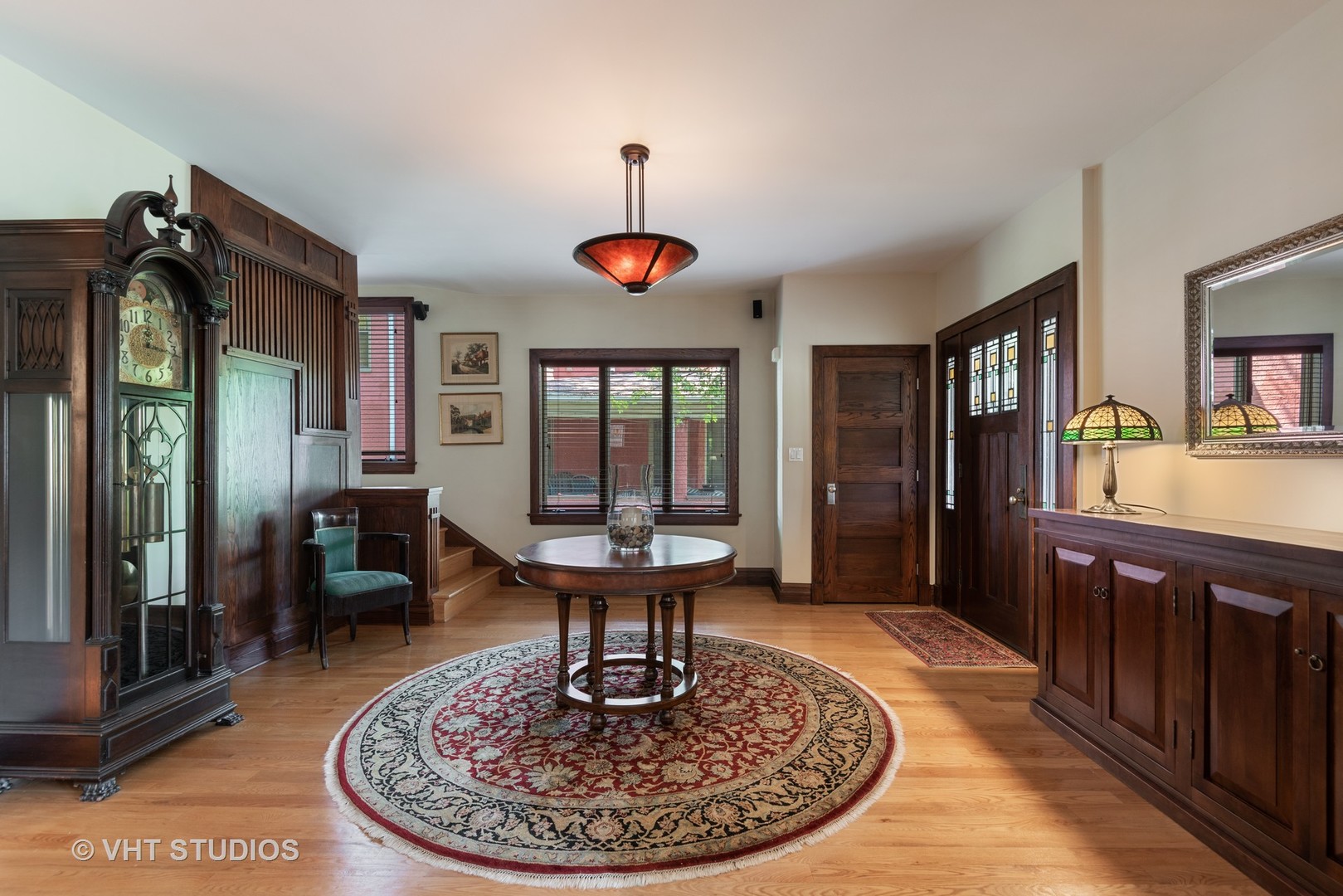 7406 North Sheridan Road Chicago, IL 60626 - Photo 5 of 37 a view of a livingroom with furniture wooden floor a chandelier
