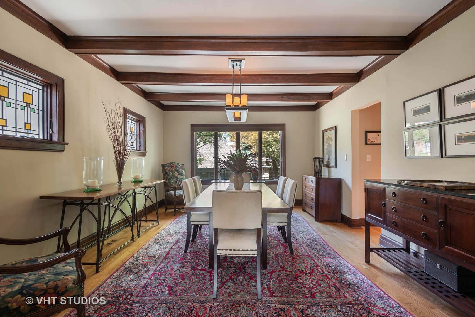 7406 North Sheridan Road Chicago, IL 60626 - Photo 9 of 37 a dining room with furniture a chandelier and window