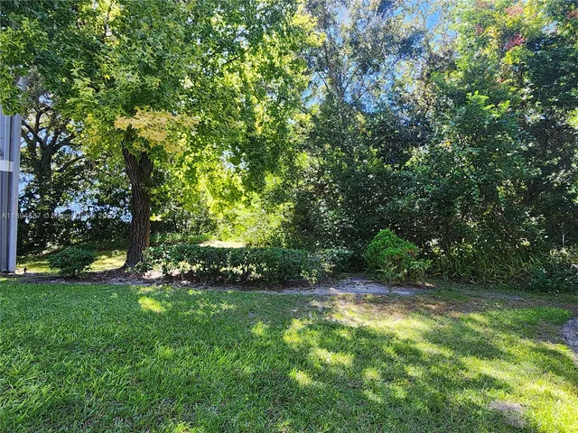 a view of a building with a big yard